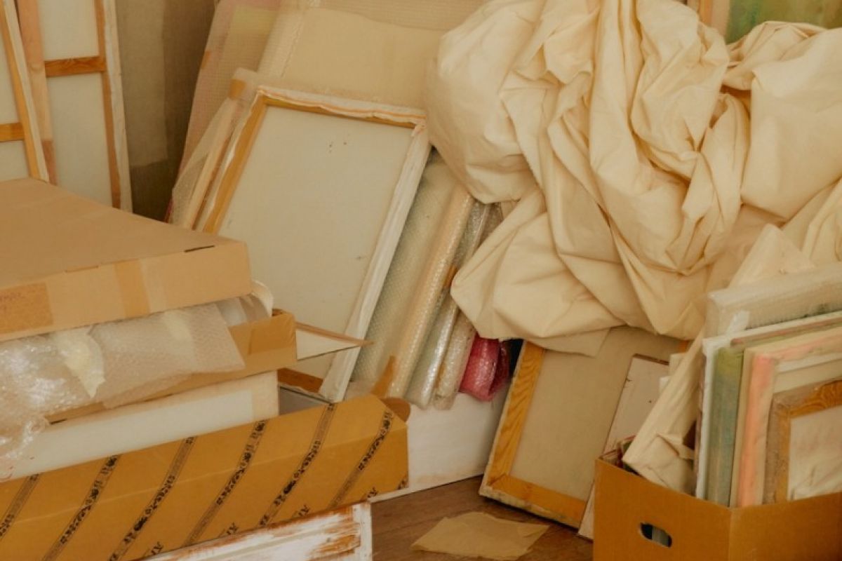 Artist canvases and muslin in boxes in storage